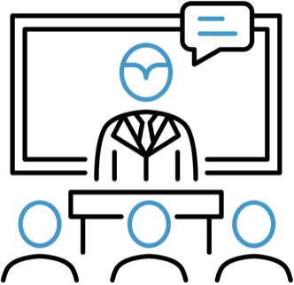 A picture of a person standing at a podium in front of a whiteboard, speaking to three people